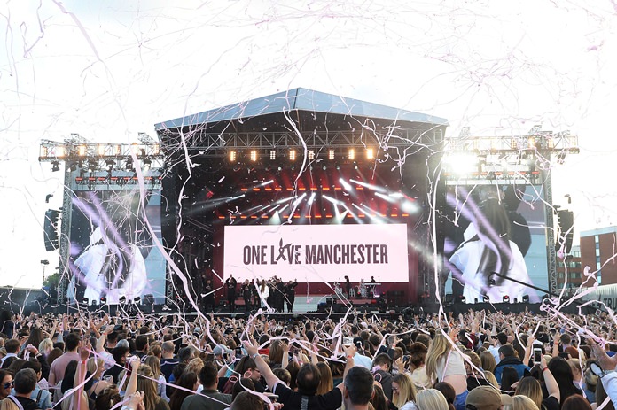 Crowds cheer at the One Love Manchester tribute concert in Manchester, Sunday, June 4. The event raised more than £10 million for those affected by the bombing in Manchester on May 22. (Dave Hogan via AP)
