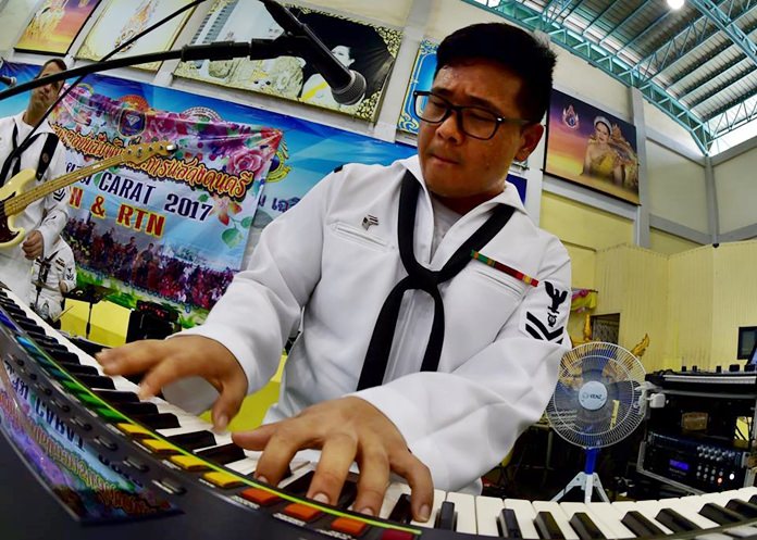 Navy Musician 2nd Class Daniel Park, of the U.S. 7th Fleet Band, Orient Express, jams out during a performance at Pattaya City School No. 8 June 2. 