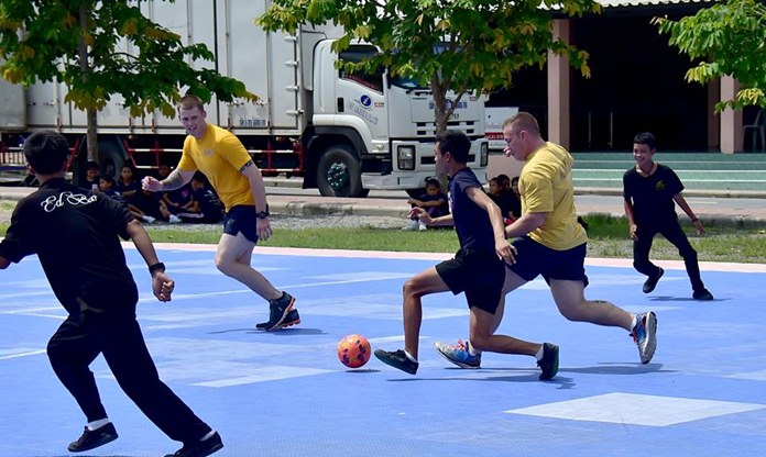 Sailors attached to USS Coronado (LCS 4) play soccer with children from Banntunggard School during a community outreach event as part of Cooperation Afloat Readiness and Training Thailand 2017 May 31. 