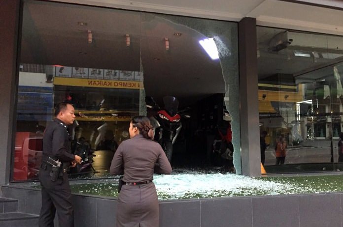 Four men are being sought for spraying the front of a Ducati motorcycle showroom with bullets in Pattaya.
