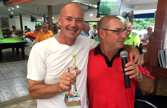 Andre Coetzee (left) collects the matchplay trophy after his team’s victory over TPL.