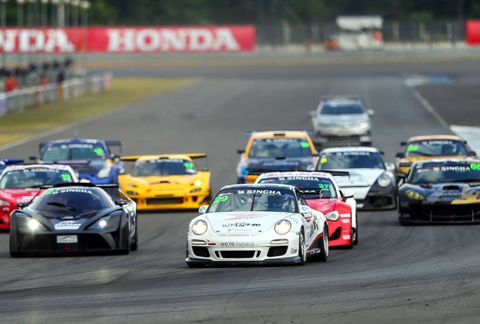 Thomas Raldorf (front centre) races his Unixx–TR-Motorsport team Porsche 911 into to the first corner of the Chang International Circuit in Buriram during the opening round of the Thailand Super Series.