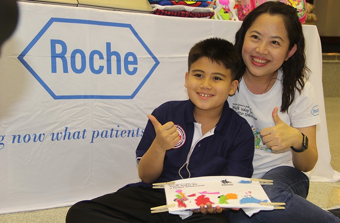 One young boy with his finished t-shirt.