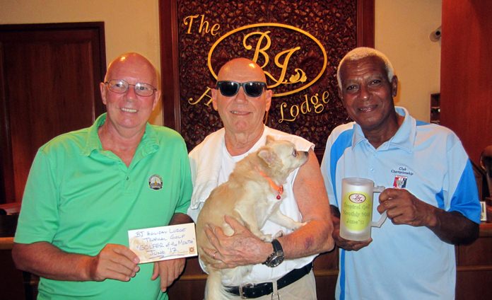 Brian Parish (left) and Landis Brooks (right) with Bill Jones of The BJ Holiday Lodge.