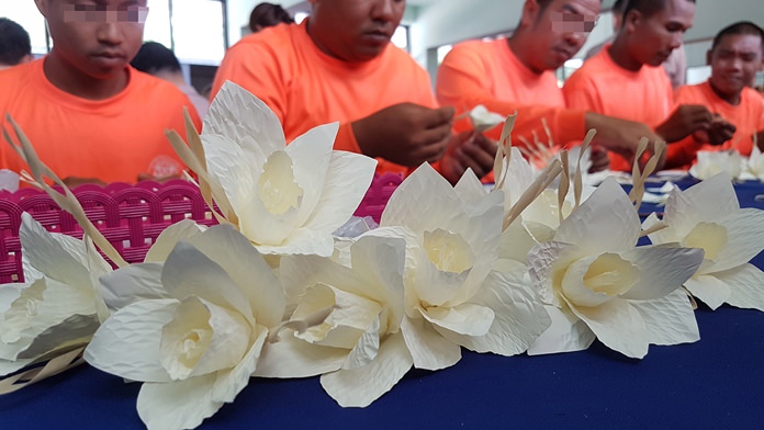 Rehabilitating addicts at Royal Thai Navy rehabilitation center made themselves part of the cremation for HM the late King by creating 9,999 artificial flowers for the October ceremony.