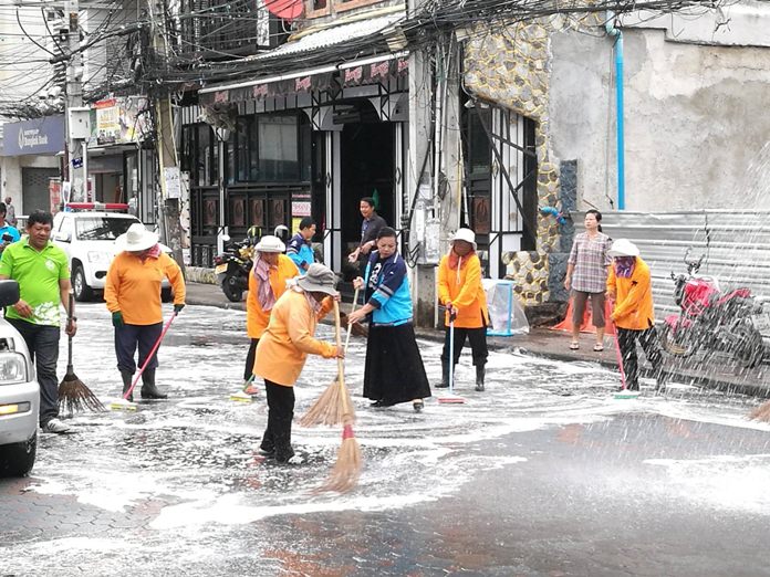 On Walking Street, workers from the Environment Department join business owners and residents cleaning up the nightlife strip.