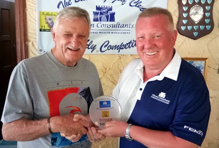 John Player (left) receives his monthly medal from Brian Chapman.