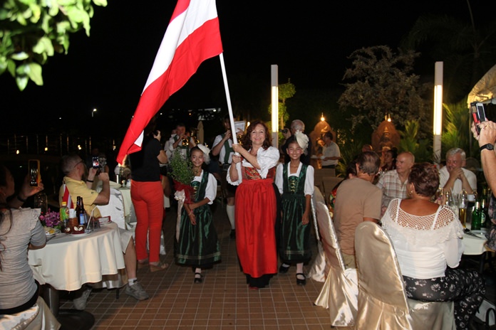 Elfi Seitz leads the lively parade onto the festive stage.
