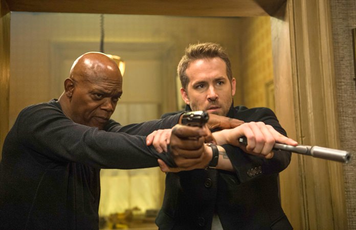 This image shows Samuel L. Jackson (left) and Ryan Reynolds in “The Hitman’s Bodyguard.” (Jack English/Lionsgate via AP)