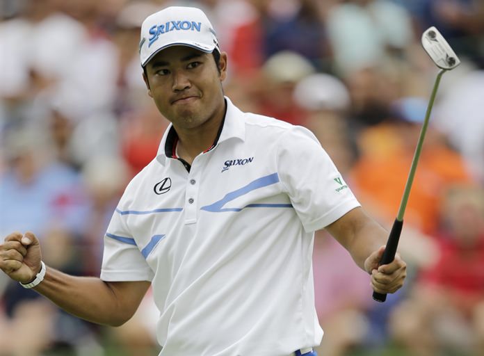 Hideki Matsuyama, from Japan, pumps his fist after his birdie putt on the 18th hole in the final round of the Bridgestone Invitational golf tournament at Firestone Country Club, Sunday, Aug. 6, in Akron, Ohio. (AP Photo/Tony Dejak)