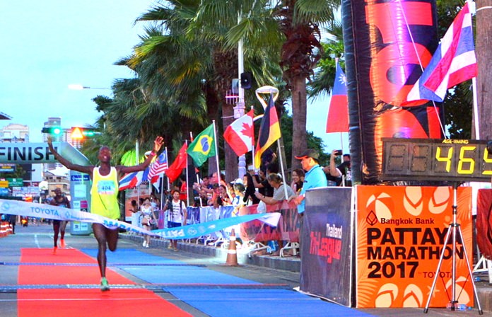 Gilbert Muge, of Kenya, races to cross the finish-line on his way to winning the Pattaya Marathon 2017.