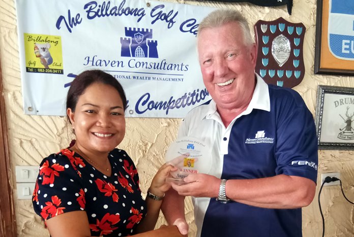 Brian Chapman presents a trophy to Miss Eng.