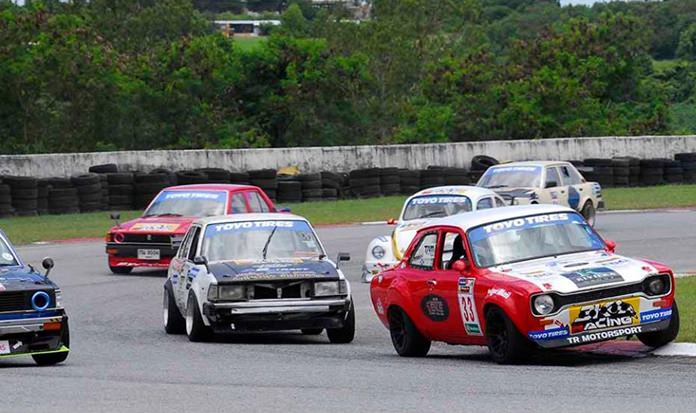 Dr. Iain Corness (right) drives his 1973 Ford Escort Mk 1 through a curve at Bira International Circuit during the TOYO 3K race meeting, Sunday, September 3.