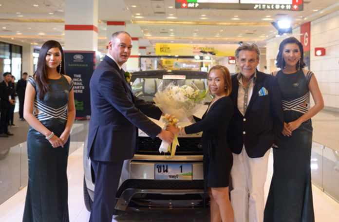 (From left) Jack Salsbury, the general manager of Range Rover presents flowers to Bo while Axel proudly looks on.