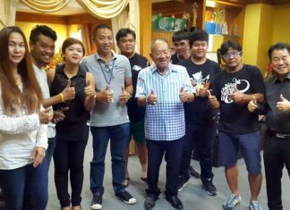 Friends and family congratulate Nongprue Mayor Mai Chaiyanit on his 71st birthday.