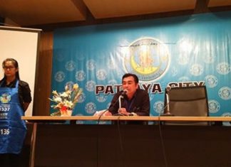 Big brother announces the no alcohol policy and had a woman display the apron beach vendors are required to wear.