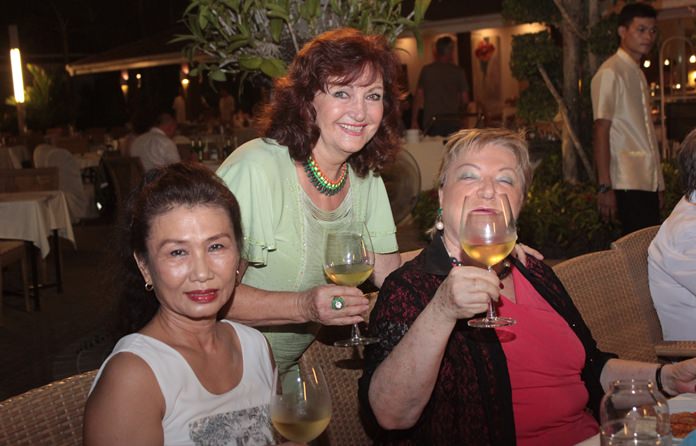 (From left) Nittaya Patimasongkroh, Gina Herning drink a toast to Elfi’s health.