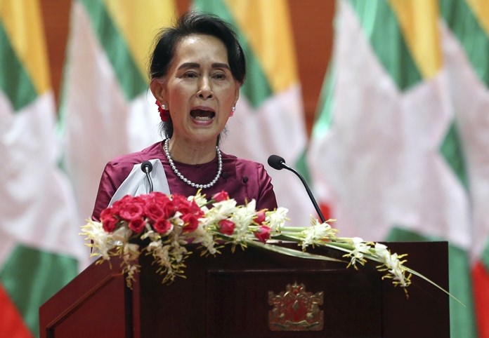 In this Tuesday, Sept. 19, 2017 file photo, Myanmar’s State Counselor Aung San Suu Kyi delivers a televised speech to the nation at the Myanmar International Convention Center in Naypyitaw, Myanmar. After a mass exodus of Rohingya Muslims sparked allegations of ethnic cleansing, Myanmar leader Aung San Suu Kyi said Tuesday her country does not fear international scrutiny. (AP Photo/File)