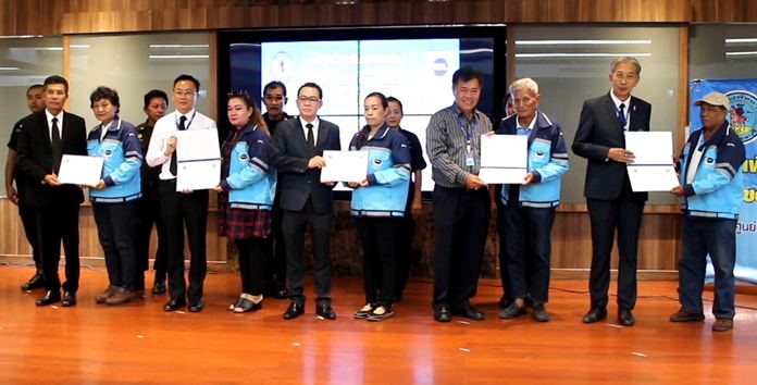 Representatives from the Pattaya complaint center thank the first of 37 organizations helping the center fulfill its goal of serving residents and tourists.