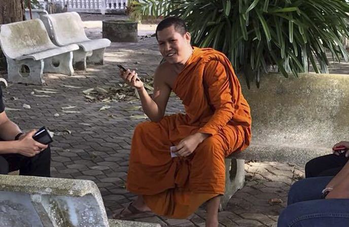 In this Tuesday, Sept. 19, 2017, photo, Buddhist monk Apichart Punnajanto sits in a courtyard in Songkhla, southern Thailand. Authorities detained Apichart on Tuesday who has posted online videos that harshly denounce Islam. (AP Photo)