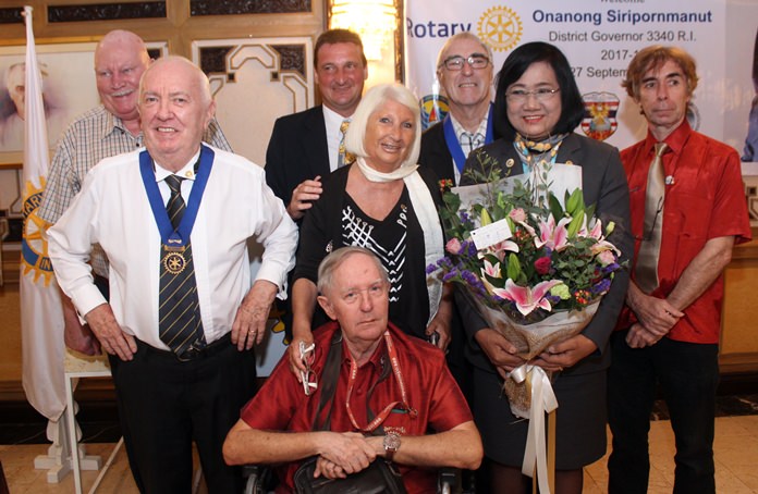 Members of the Rotary Club Pattaya Marina pose for a photograph with DG Onanong.