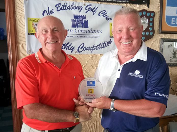 Jeff North (left) receives his medal from Brian Chapman.