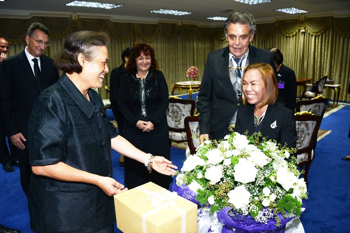 HRH the Princess graciously accepts gifts from the German visitors.