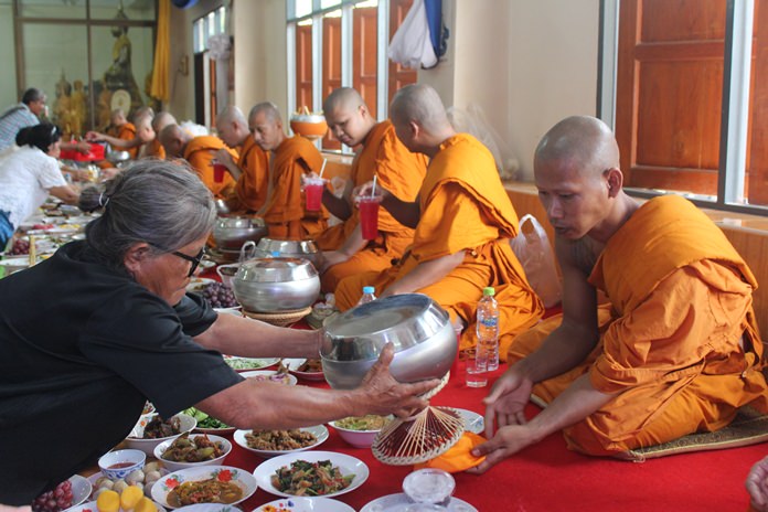 Presenting alms at Wat Suttawas.