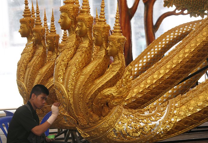 An artist sculpts deities and creatures from ancient epics to decorate the royal crematorium and funeral complex for the late Thai King Bhumibol Adulyadej. (AP Photo/Sakchai Lalit)