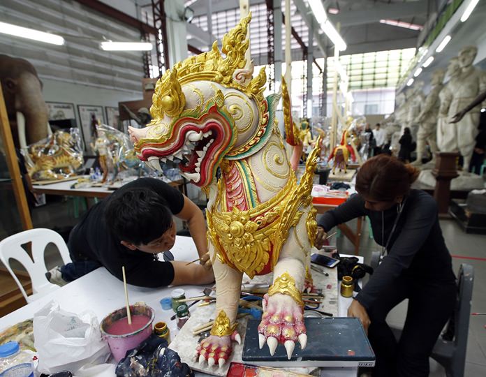 Artists sculpt deities and creatures from ancient epics to decorate the royal crematorium. (AP Photo/Sakchai Lalit)