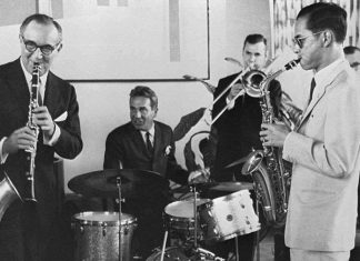 His Majesty the late King Bhumibol Adulyadej (right) plays the saxophone during a jam session with legendary jazz clarinetist Benny Goodman (left), drummer Gene Krupa (second left), and trombonist Urbie Green in New York, July 5, 1960. (Bureau of the Royal Household via AP)