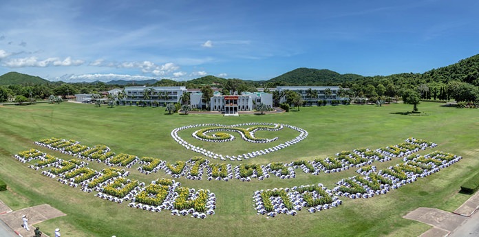 Nearly 1,300 sailors prostrated themselves in formation to spell out a message in honor of HM the late King Rama IX.