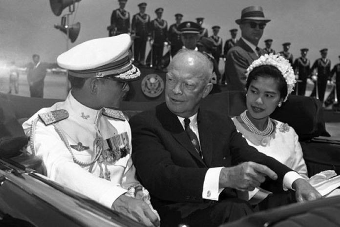 In this June 28, 1960, file photo, U.S. President Dwight Eisenhower, center, is seated between His Majesty King Bhumibol Adulyadej of Thailand, left, and Queen Sirikit for a motorcade drive in Washington D.C. (AP Photo)