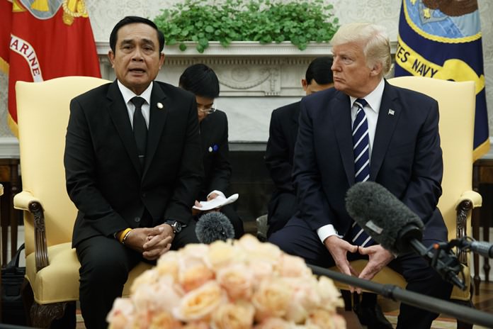President Donald Trump listens as Thai Prime Minister Prayuth Chan-ocha speaks during a meeting in the Oval Office of the White House, Monday, Oct. 2, 2017, in Washington. (AP Photo/Evan Vucci)