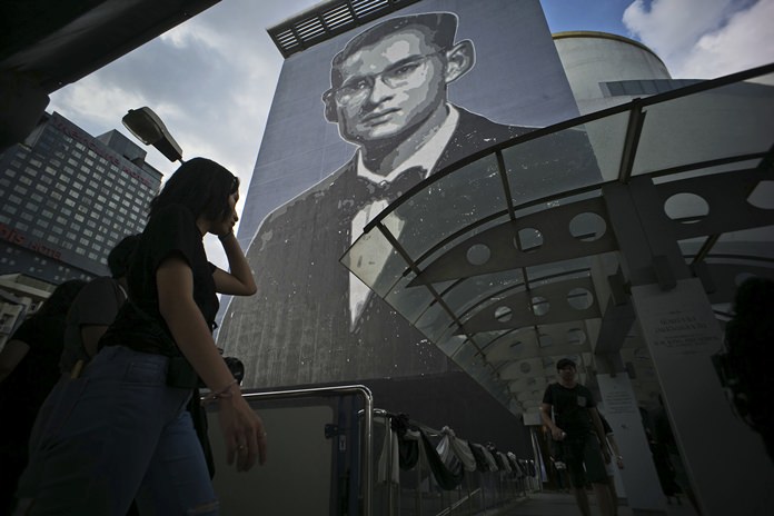 An image of the late Thai King Bhumibol Adulyadej covers the side of a building in Bangkok. (AP Photo/Charles Dharapak)