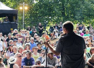 Music fans soak up the sun and atmosphere on Day 1 of the festival. (Photo/Strang The Steward)