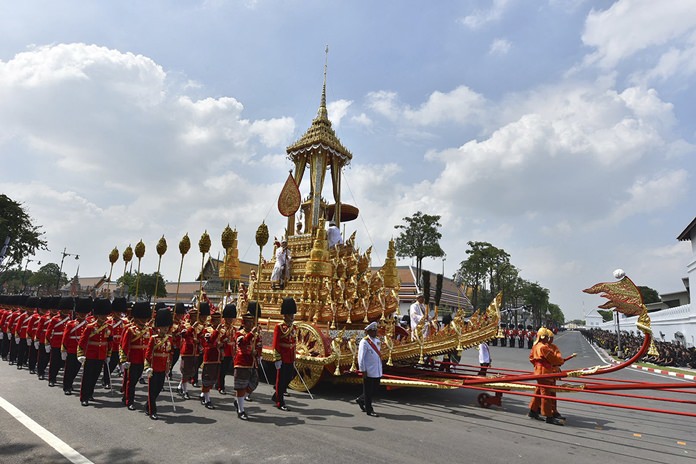 The symbolic urn is transported during the funeral procession of late King Bhumibol Adulyadej in Bangkok, Thursday, Oct. 26, 2017. A ceremony in an ornate throne hall Thursday morning began the transfer of the remains of Thailand’s King Bhumibol Adulyadej to his spectacular golden crematorium in the royal quarter of Bangkok after a year of mourning for the monarch Thais hailed as “Father.” (AP Photo/Kittinun Rodsupan)