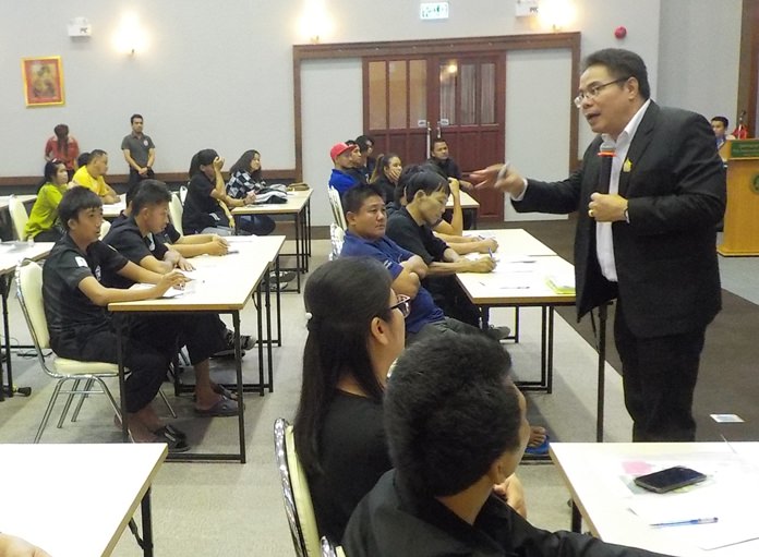 Boontart Sopa, director of equality and litigation support at the Department for Empowerment of Persons with Disabilities, teaches Pattaya-area disabled residents how to ace a job interview and informs them of their legal rights during a Redemptorist Vocational School seminar.