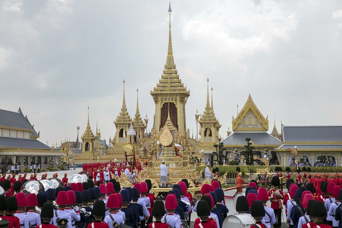 The ceremonial urn of Thailand’s late King Bhumibol Adulyadej arrives at the crematorium during the funeral procession as royal crematorium is seen in the background. (AP Photo/Wason Wanichakorn)