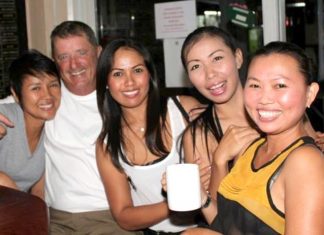 Don Lehmer (2nd left) celebrates with the girls at the TPL.