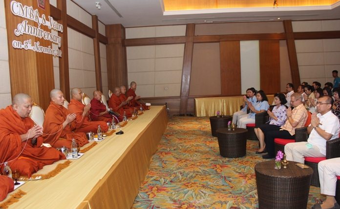 Nine monks from Jittapawan Temple chant before being treated to a lunchtime meal.