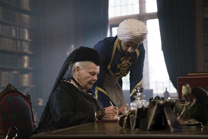 Judi Dench (left) and Ali Fazal appear in a scene from “Victoria and Abdul.” (Peter Mountain/Focus Features via AP)