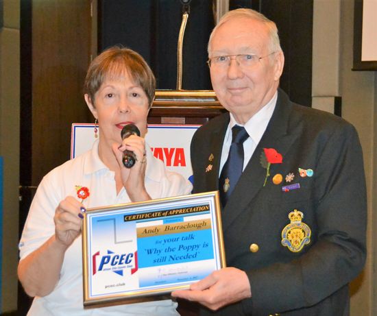 MC Judith Edmonds presents Andy Barraclough with the PCEC’s Certificate of Appreciation for his timely remarks about Remembrance Day and the work the British Legion accomplishes with its annual Poppy Appeal.