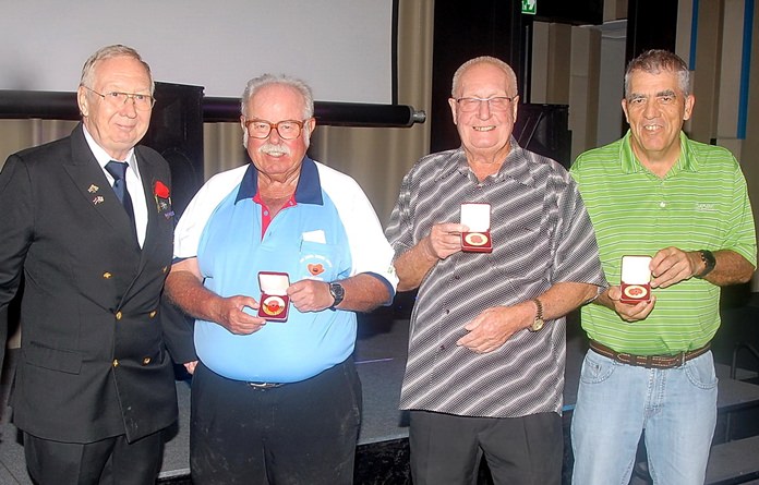 (From left) Andy Barraclough, Chairman of The Royal British Legion Thailand, presents to Dave Richardson, Jim Elphick and Chris Balzis.