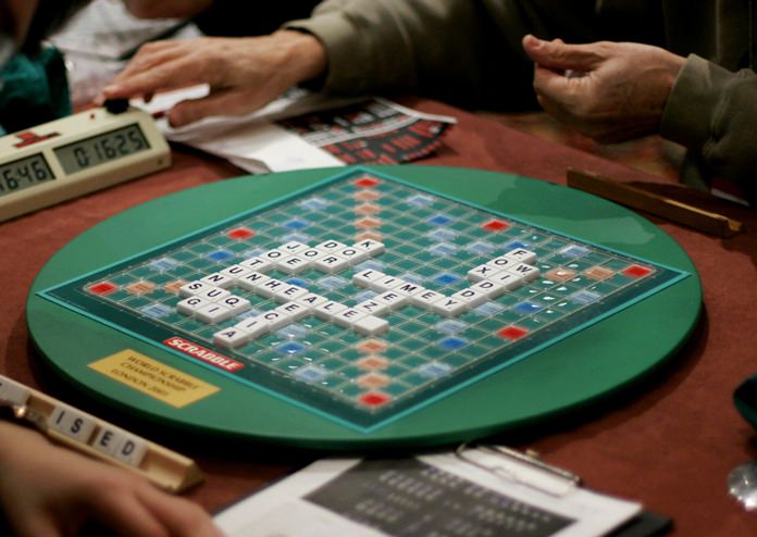 Competitors take part in the World Scrabble Championships in London. (AP Photo/Matt Dunham)