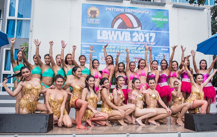The top three teams pose for a group photo at the conclusion of the ladyboy water-volleyball championship, held at Areca Lodge in Pattaya. November 11.