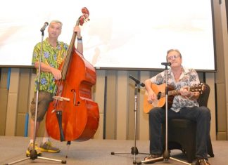 Pattaya musicians Bernie Webb on guitar with Paul Rosenberg on double bass entertained with several popular songs appropriate for their PCEC audience with many of them joining in.