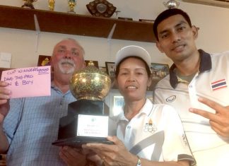 Tournament winners Dave, On and Boy pose with the trophy.