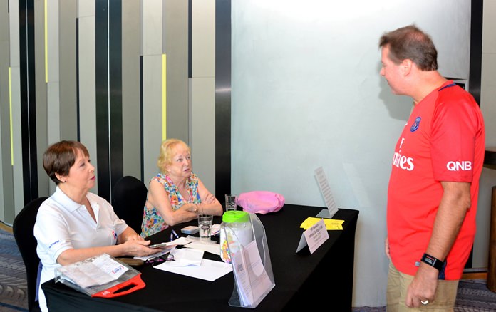 Membership Secretary Judith Edmonds (left) assisted by Governing Board Member Anne Smith (center) explains to a visitor the advantages of being a member of the PCEC.