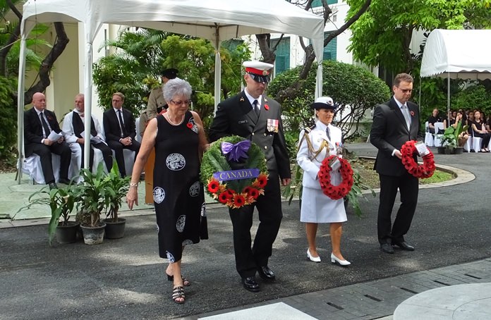 Members of the Canada Embassy present a heartfelt wreath.